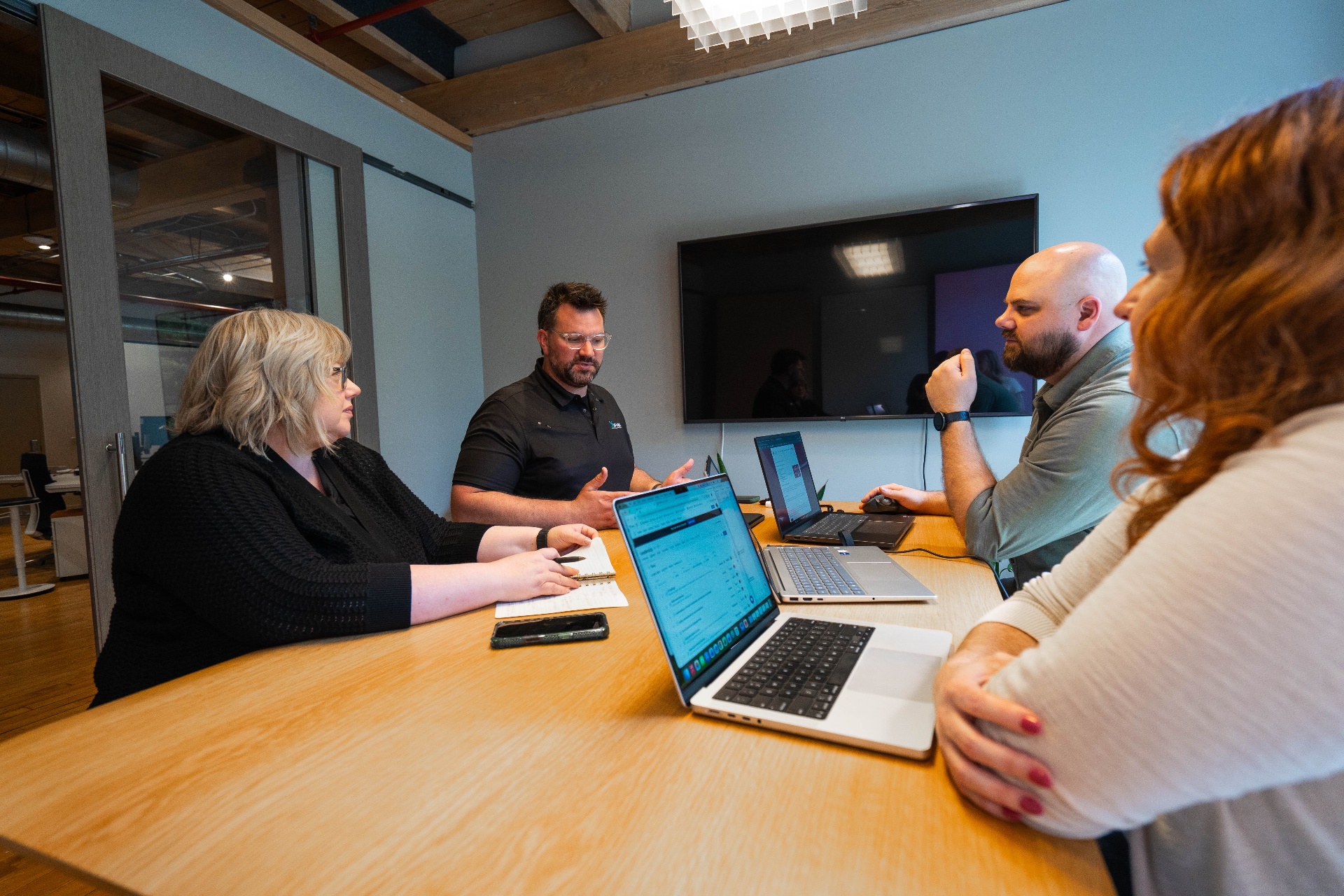 The Xwurk team collaborating around a conference table