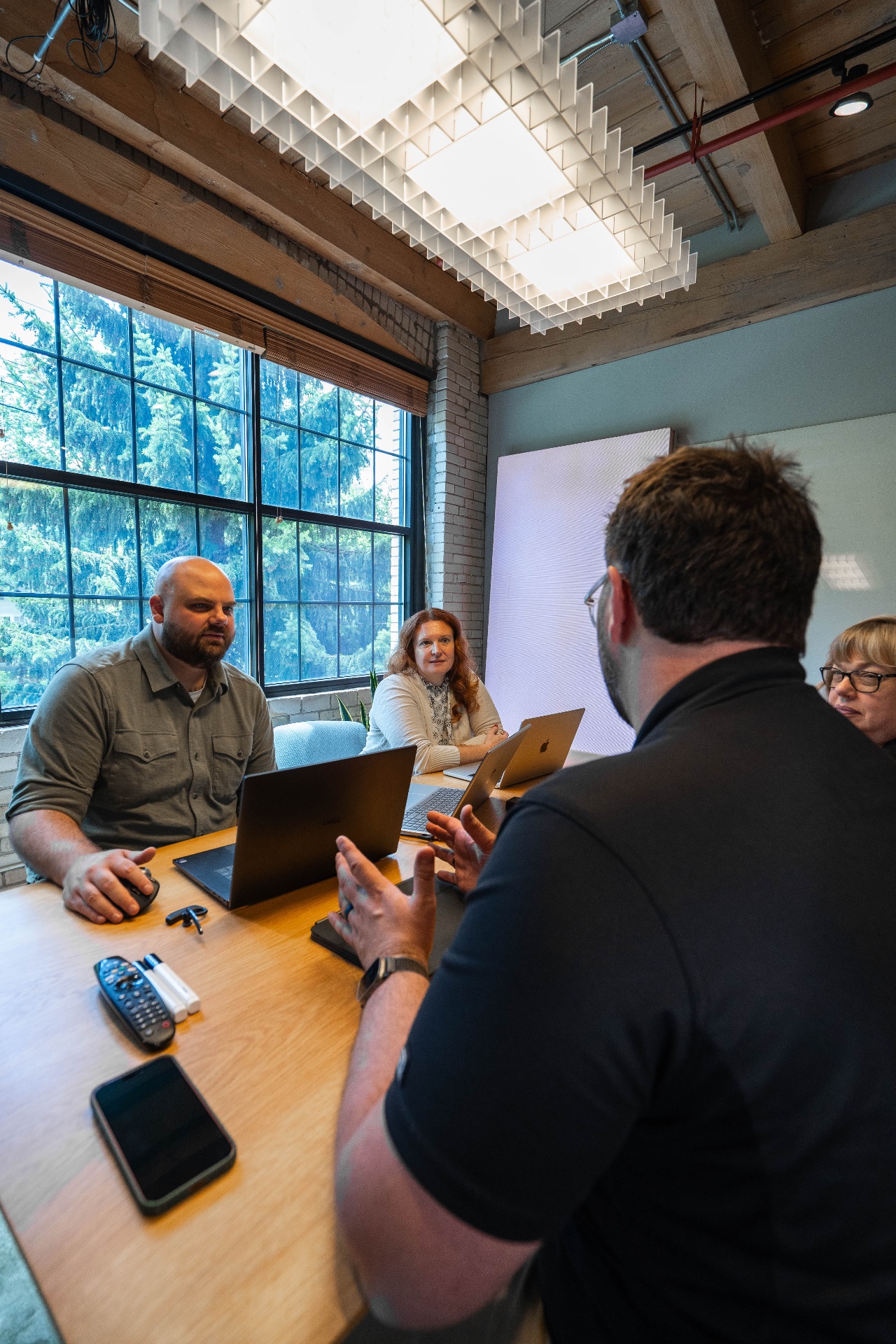 The Xwurk team discussing growth strategy around a conference table